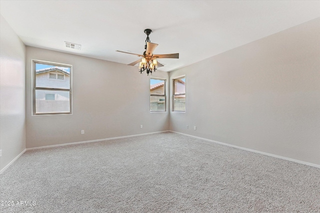 3310 W Chambers St, Phoenix, AZ 85041 - unfurnished room featuring plenty of natural light, carpet flooring, and a ceiling fan