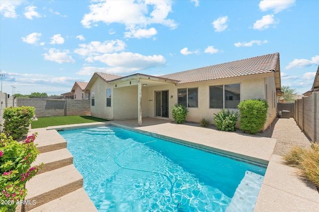 3310 W Chambers St, Phoenix, AZ 85041 - rear view of property featuring a tile roof, stucco siding, a fenced backyard, and a patio