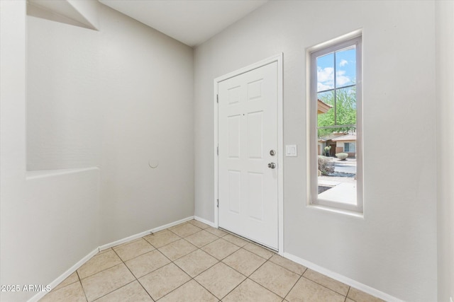 3310 W Chambers St, Phoenix, AZ 85041 - foyer entrance featuring light tile patterned floors and baseboards