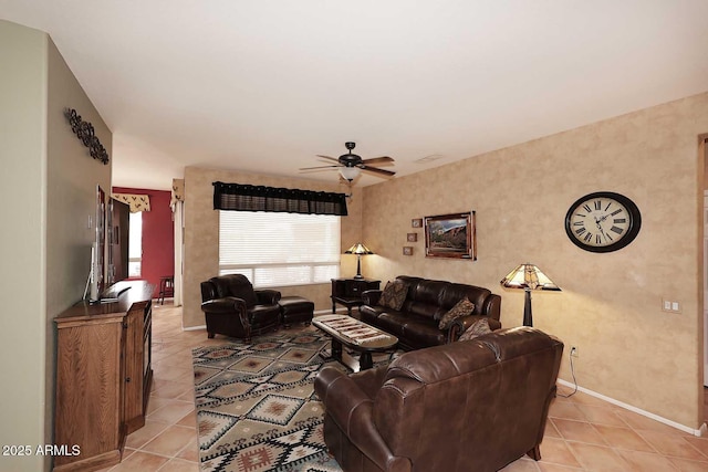 17630 N Somerset Dr, Surprise, AZ 85374 - living area with light tile patterned floors, a ceiling fan, and baseboards