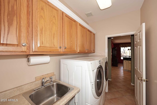 17630 N Somerset Dr, Surprise, AZ 85374 - washroom featuring separate washer and dryer, cabinet space, and light tile patterned flooring
