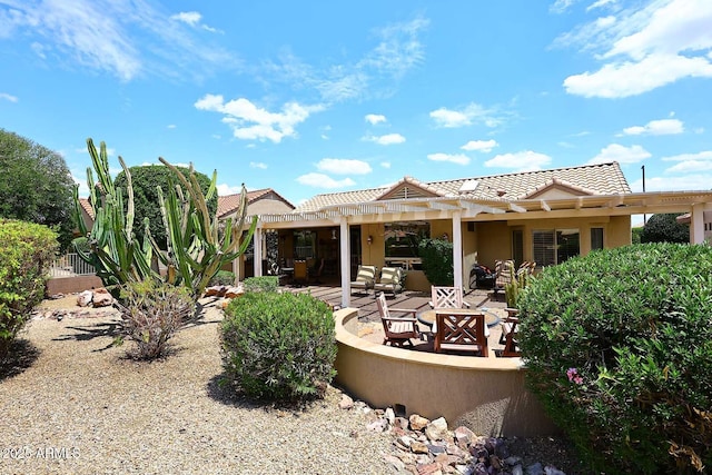 17630 N Somerset Dr, Surprise, AZ 85374 - rear view of house featuring a pergola, a tiled roof, stucco siding, a patio area, and outdoor lounge area