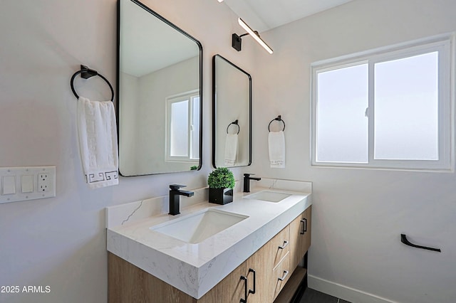 bathroom featuring vanity and plenty of natural light