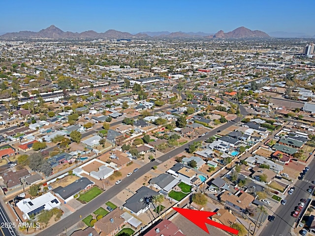 birds eye view of property with a mountain view