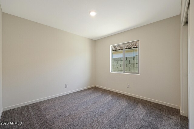 551 S W Virginia Ave, Florence, AZ 85132 - spare room featuring baseboards and dark carpet