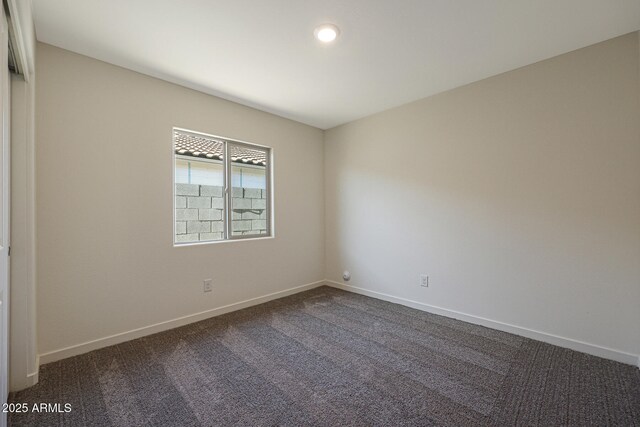 551 S W Virginia Ave, Florence, AZ 85132 - unfurnished room featuring dark carpet and baseboards