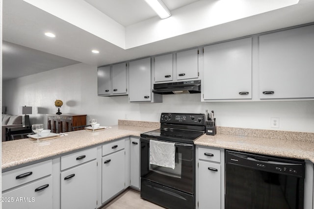 4150 E Cactus Rd Unit 205, Phoenix, AZ 85032 - kitchen featuring black appliances, under cabinet range hood, light countertops, recessed lighting, and a peninsula