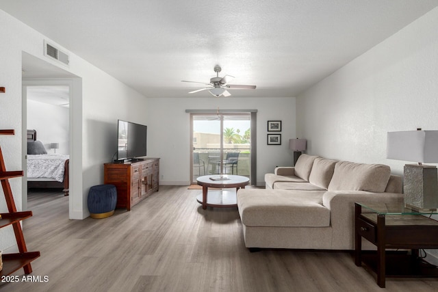 4150 E Cactus Rd Unit 205, Phoenix, AZ 85032 - living area with light wood-style floors and a ceiling fan