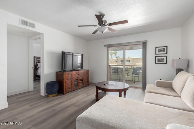 4150 E Cactus Rd Unit 205, Phoenix, AZ 85032 - living room featuring a ceiling fan and wood finished floors