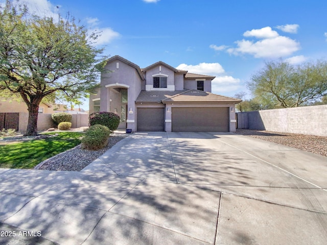 view of front of home featuring stucco siding, concrete driveway, fence, a garage, and a tiled roof