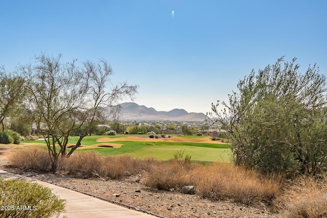 view of property's community featuring golf course view and a mountain view