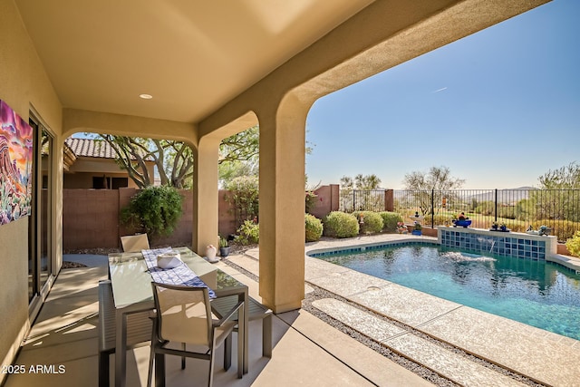 view of swimming pool featuring a fenced in pool, outdoor dining area, a fenced backyard, and a patio