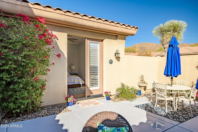 view of patio / terrace featuring a mountain view