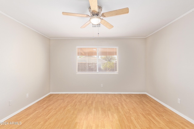 empty room featuring crown molding, light wood-type flooring, and ceiling fan