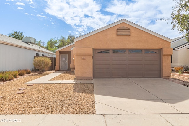 ranch-style home with a garage