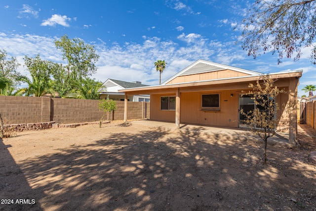 rear view of property with a patio area