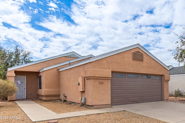 view of front of property featuring a garage