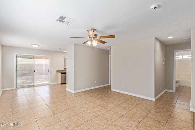 spare room featuring light tile patterned flooring and ceiling fan