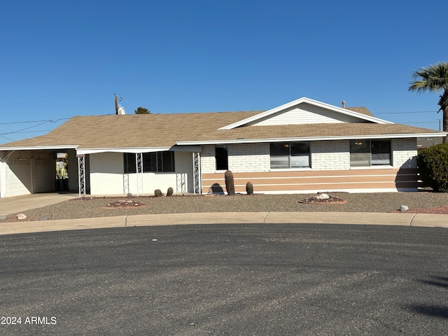 single story home with a carport