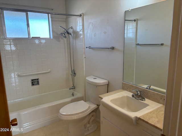 full bathroom featuring tile patterned floors, vanity, toilet, and tiled shower / bath