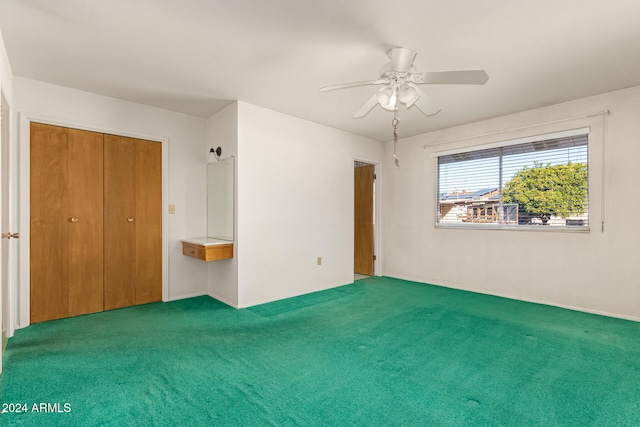 unfurnished bedroom featuring carpet, a closet, and ceiling fan