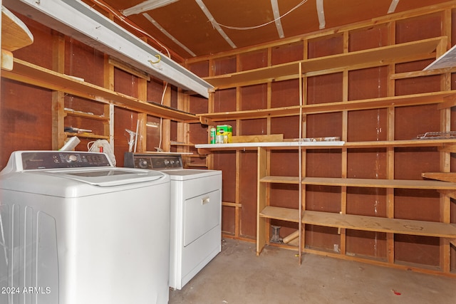 clothes washing area with independent washer and dryer