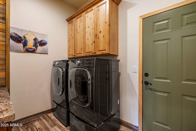 2352 Immelman Cir, Overgaard, AZ 85933 - laundry area with cabinet space, separate washer and dryer, wood finished floors, and baseboards