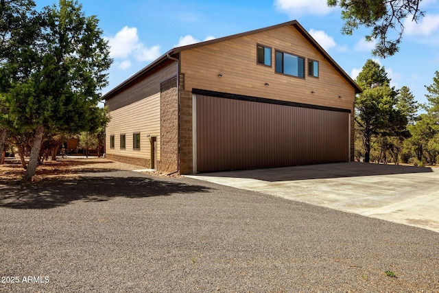 2352 Immelman Cir, Overgaard, AZ 85933 - view of side of property featuring a garage and driveway