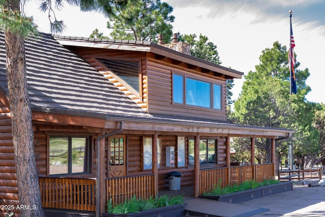 2352 Immelman Cir, Overgaard, AZ 85933 - cabin with a chimney and faux log siding