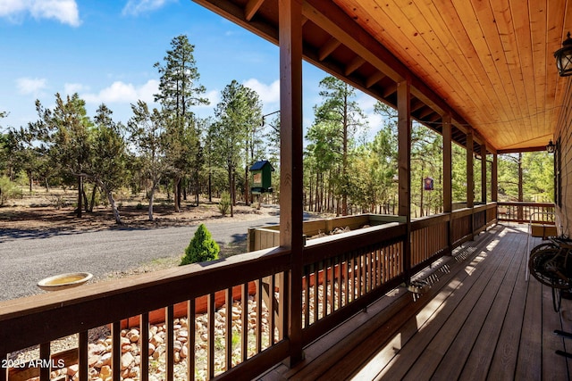 2352 Immelman Cir, Overgaard, AZ 85933 - deck featuring view of wooded area