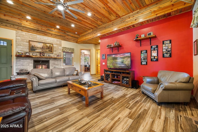 2352 Immelman Cir, Overgaard, AZ 85933 - living area featuring wooden ceiling with exposed beams, a ceiling fan, wood finished floors, recessed lighting, and a fireplace