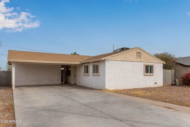 ranch-style house with central air condition unit