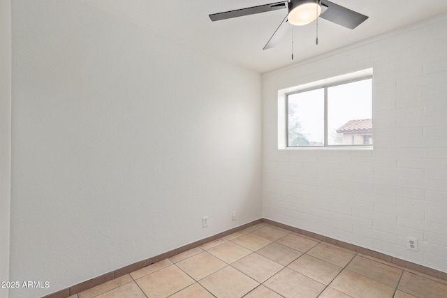 tiled empty room with ceiling fan