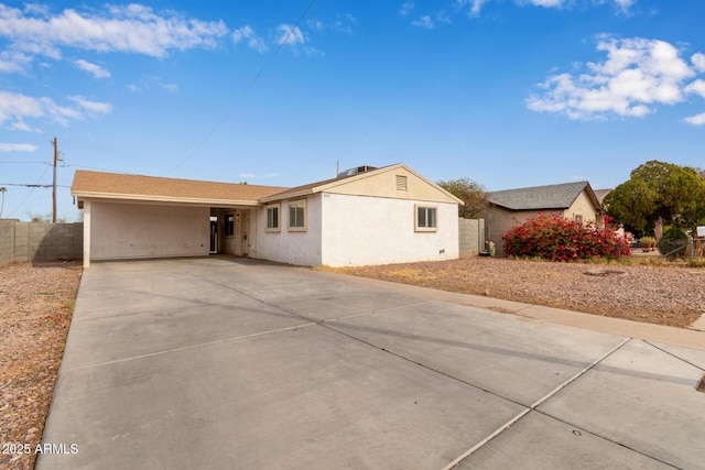 single story home with a carport