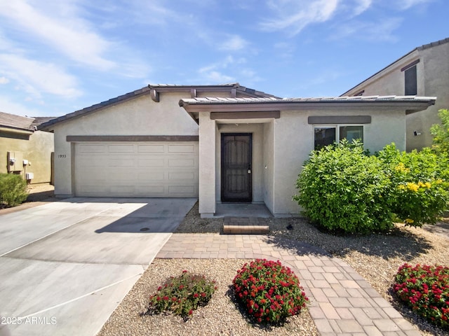 1953 W Stage Driver St, Apache Junction, AZ 85120 - view of front of house with an attached garage, stucco siding, and driveway
