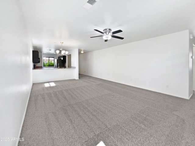1953 W Stage Driver St, Apache Junction, AZ 85120 - unfurnished living room featuring a chandelier, light carpet, and ceiling fan