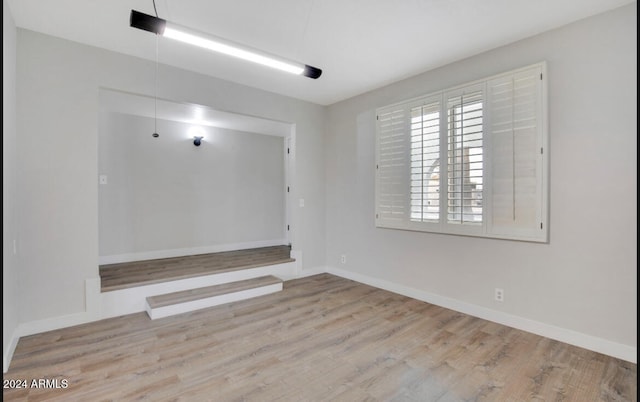 spare room with light wood-type flooring