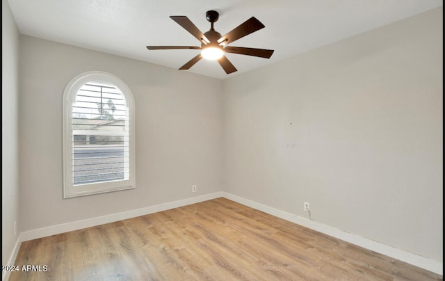 empty room featuring ceiling fan and light hardwood / wood-style floors