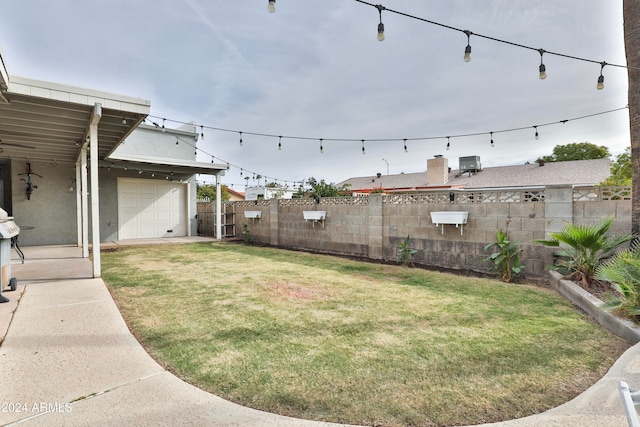 view of yard featuring a garage