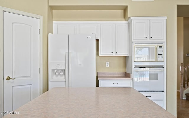 6923 W Laredo St, Chandler, AZ 85226 - kitchen with white appliances, white cabinets, and light countertops