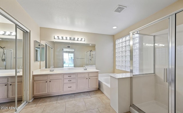 6923 W Laredo St, Chandler, AZ 85226 - full bath with double vanity, a stall shower, a garden tub, and tile patterned floors