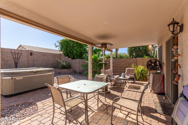 view of patio with a hot tub