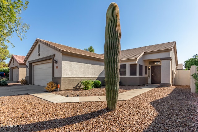 ranch-style home with a garage