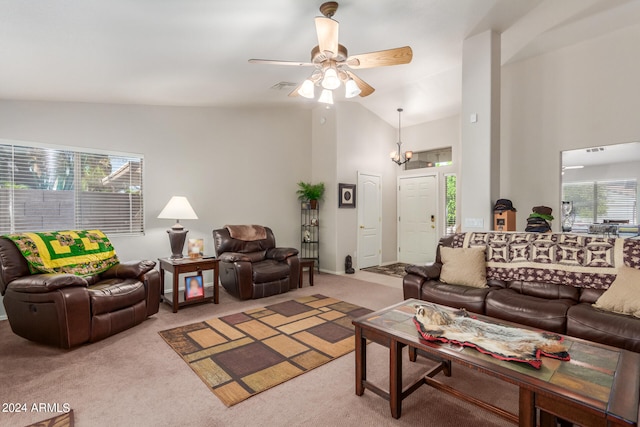 living room featuring plenty of natural light, vaulted ceiling, and light colored carpet