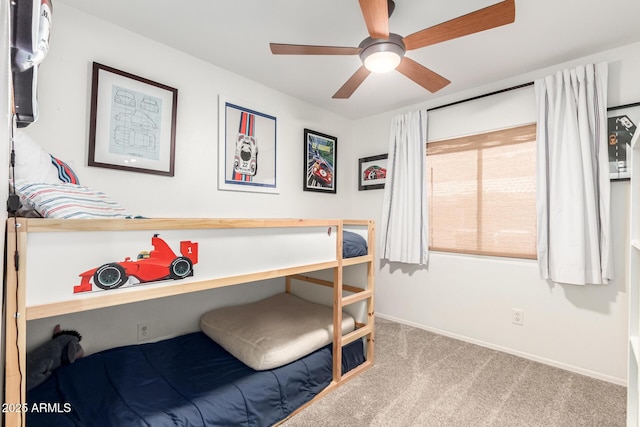 bedroom featuring carpet flooring, baseboards, and ceiling fan