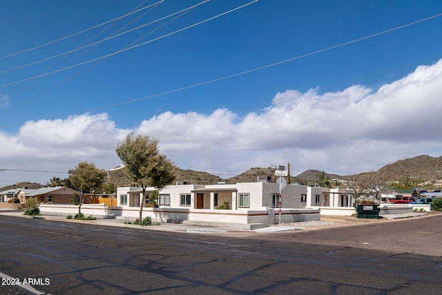 view of front of home with a mountain view