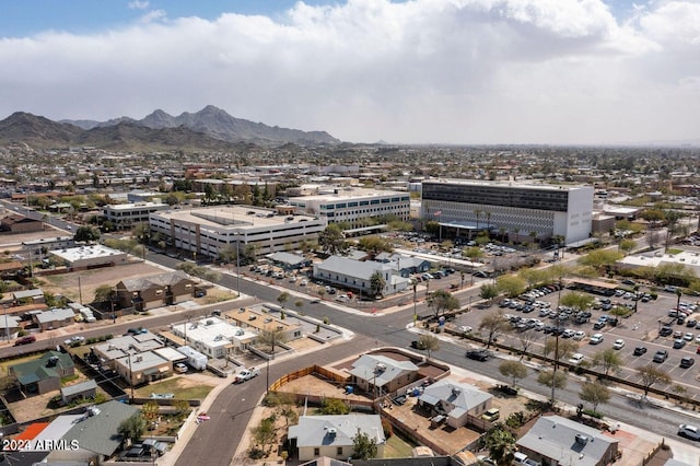 birds eye view of property with a mountain view