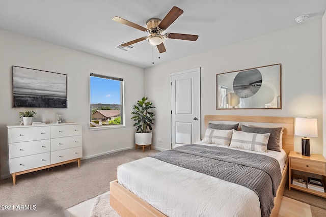 bedroom featuring ceiling fan and light colored carpet