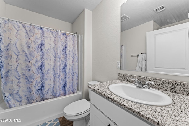 full bathroom featuring vanity, hardwood / wood-style floors, shower / bath combo with shower curtain, and toilet