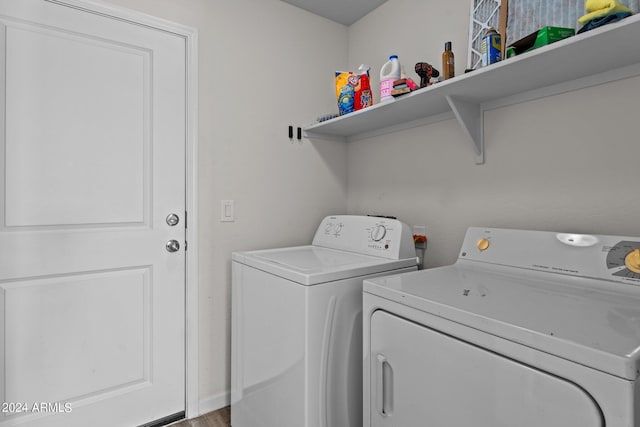 laundry area featuring washing machine and clothes dryer